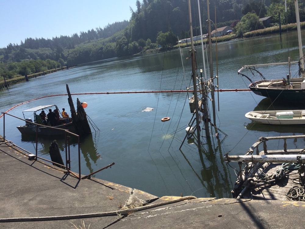 Coast Guard cleans up after fishing vessel Donna sinks at pier