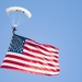 Skydiver Carries U.S. Flag Over Soldier Field