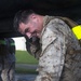 Marines conduct physical training with a combat rubber raiding craft