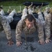 Marines conduct physical training with a combat rubber raiding craft