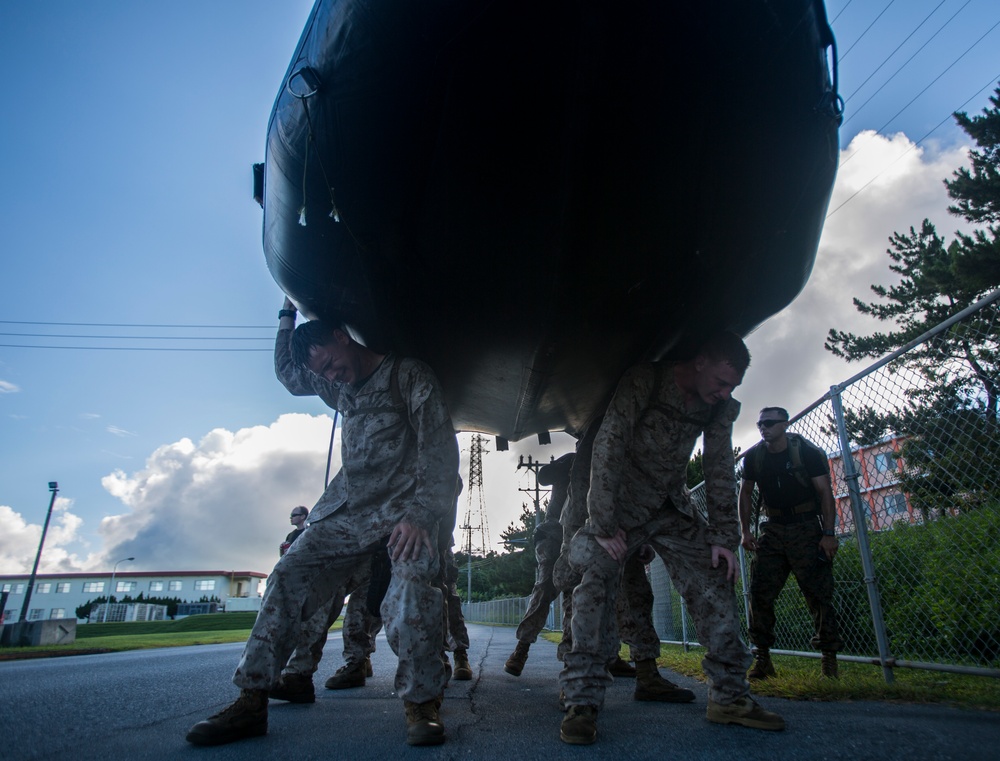 EOTG Marines conduct physical training with a combat rubber raiding craft