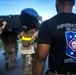 Marines conduct physical training with a combat rubber raiding craft