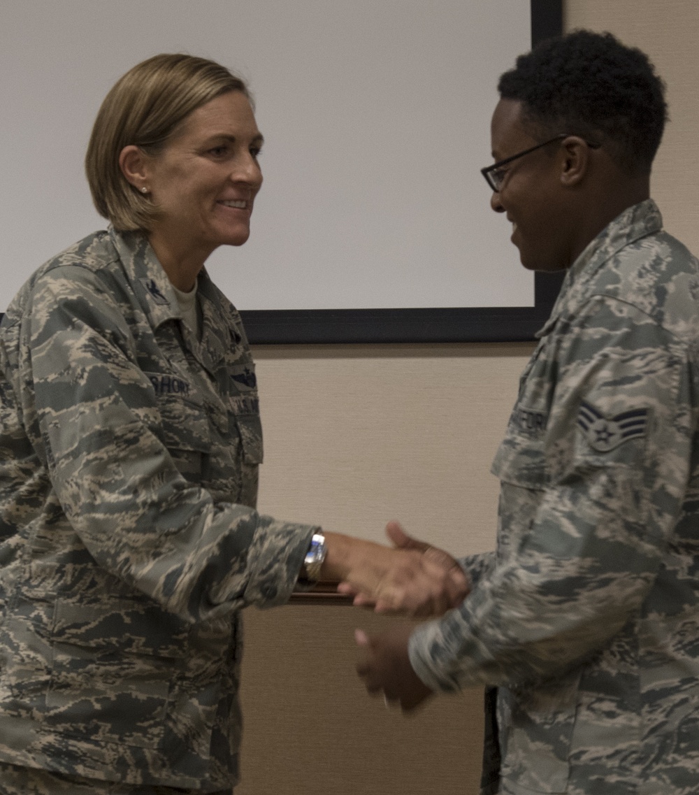 Airman receives commander's first coin