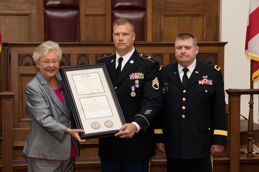 Governor Kay Ivey presents major awards to two Alabama National Guard Soldiers