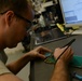 AFREP Airman fixes circuit board