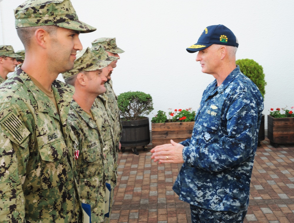 U.S. 7th Fleet Deputy Commander Rear Adm. Brian Hurley awards Navy divers Meritorious Service Medals for Fitzgerald recovery