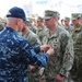 U.S. 7th Fleet Deputy Commander Rear Adm. Brian Hurley awards Navy divers Meritorious Service Medals for Fitzgerald recovery