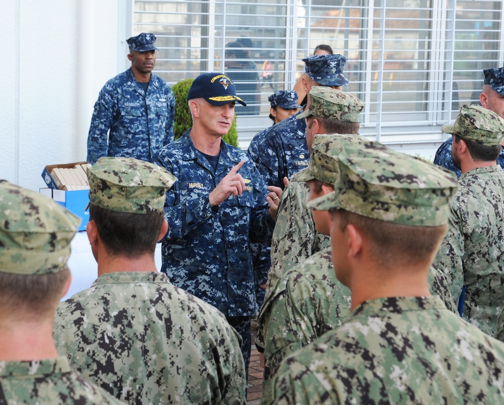 U.S. 7th Fleet Deputy Commander Rear Adm. Brian Hurley awards Navy divers Meritorious Service Medals for Fitzgerald recovery