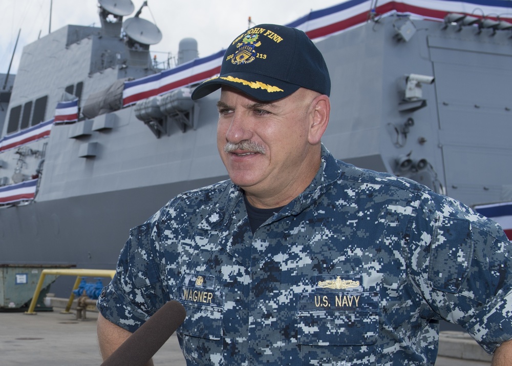 Commanding Officer for the future USS John Finn participates in media day