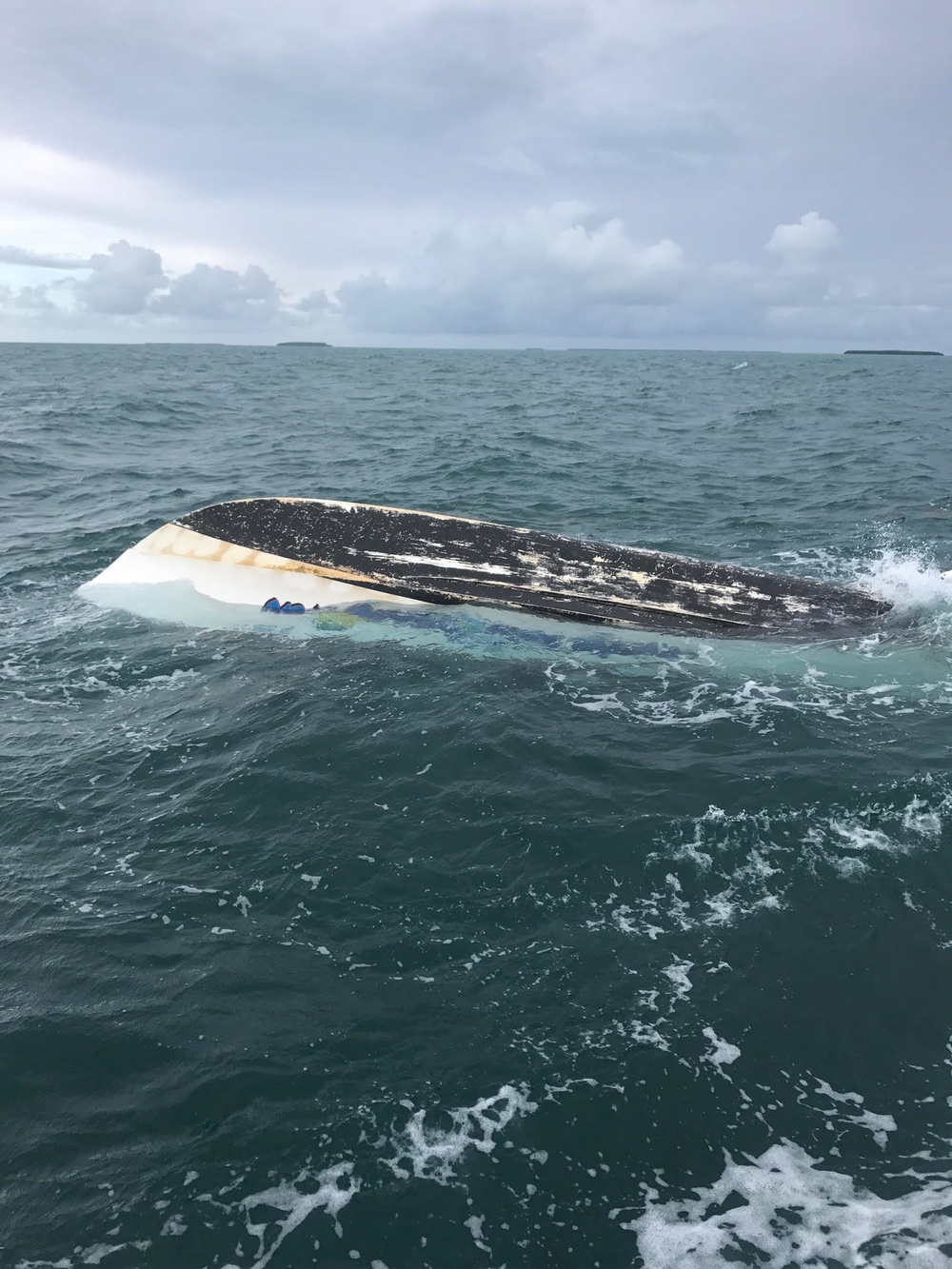 Capsized vessel Coast Guard boat crew rescued six people from