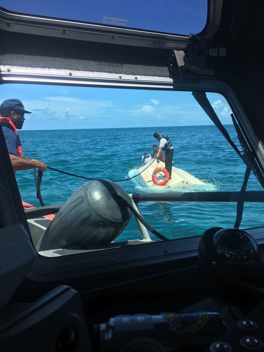 Coast Guard boat crew rescues five boaters from capsized vessel