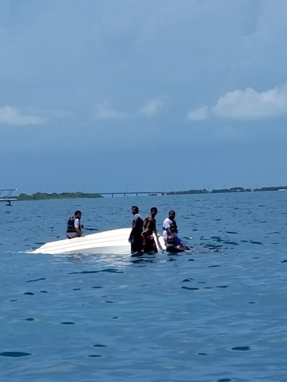 Coast Guard boat crew rescues five boaters from capsized vessel