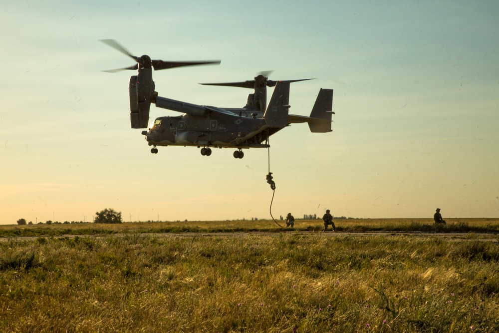U.S. Naval Special Warfare Operators fast rope from a CV-22 Osprey during Sea Breeze 17