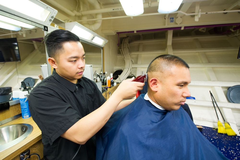 USS America Sailor gets haircut