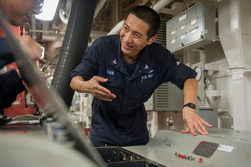 USS America Sailor conducts maintenance