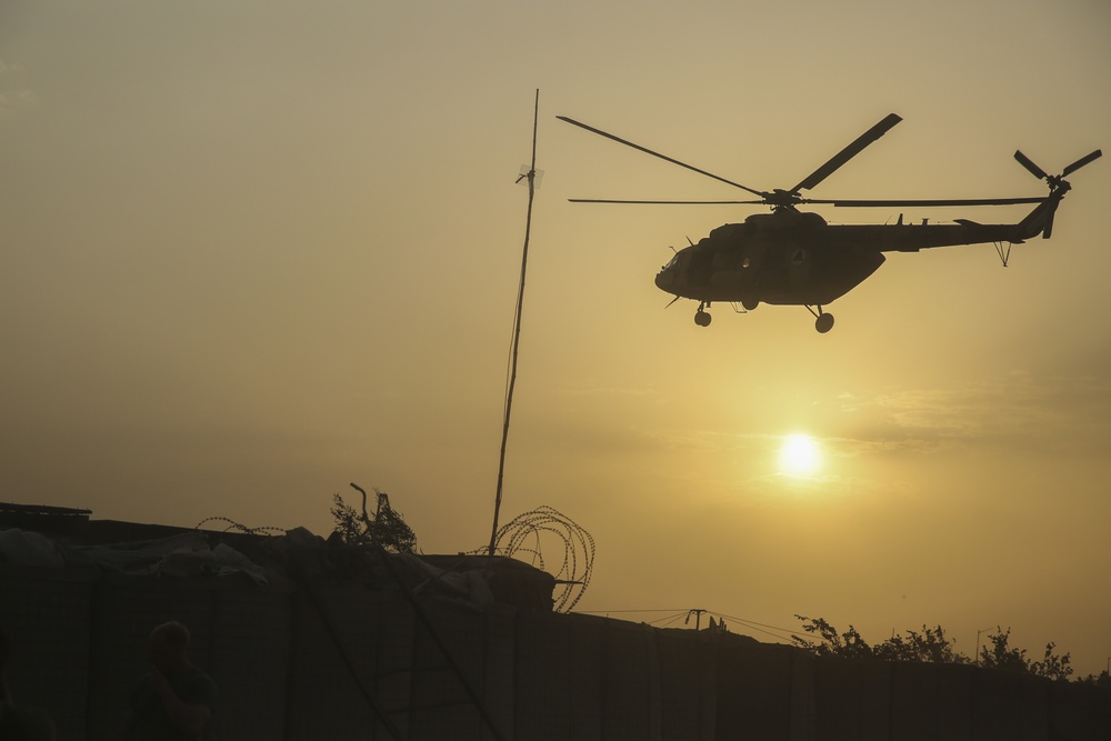 ANDSF raise flag, rename traffic circle in Nawa district center