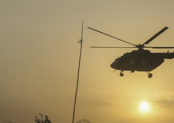 ANDSF raise flag, rename traffic circle in Nawa district center