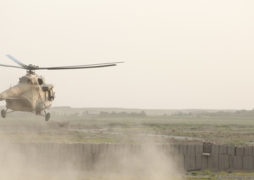 ANDSF raise flag, rename traffic circle in Nawa district center