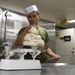 USS America Sailor prepares sweet rolls