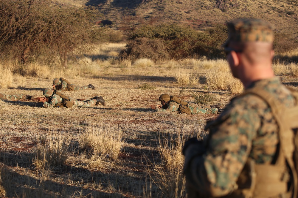 Members of the U.S. and South African armed forces conduct battle drills during Exercise Shared Accord