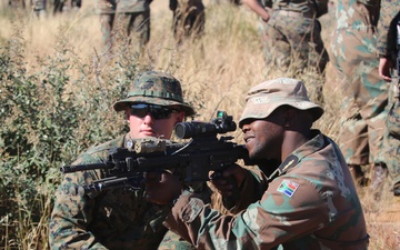 U.S. Marines and Members of the South African Maritime Reaction Squadron swap weapons during Exercise Shared Accord
