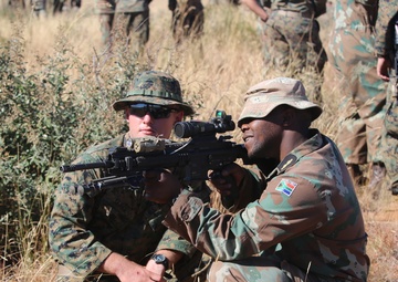 U.S. Marines and Members of the South African Maritime Reaction Squadron swap weapons during Exercise Shared Accord
