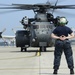 Sailor prepares to signal MH-53