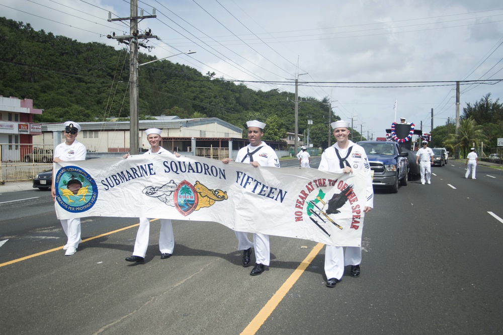 COMSUBRON 15 Sailors Carry Banner during Guam's 73rd Liberation Day Parade