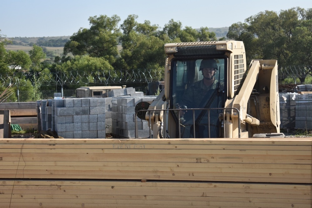 Skid-Steer moves materials during Resolute Castle 17