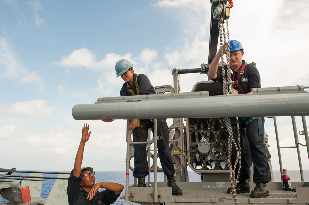 USS America Sailors move surface-to-air intercept missiles