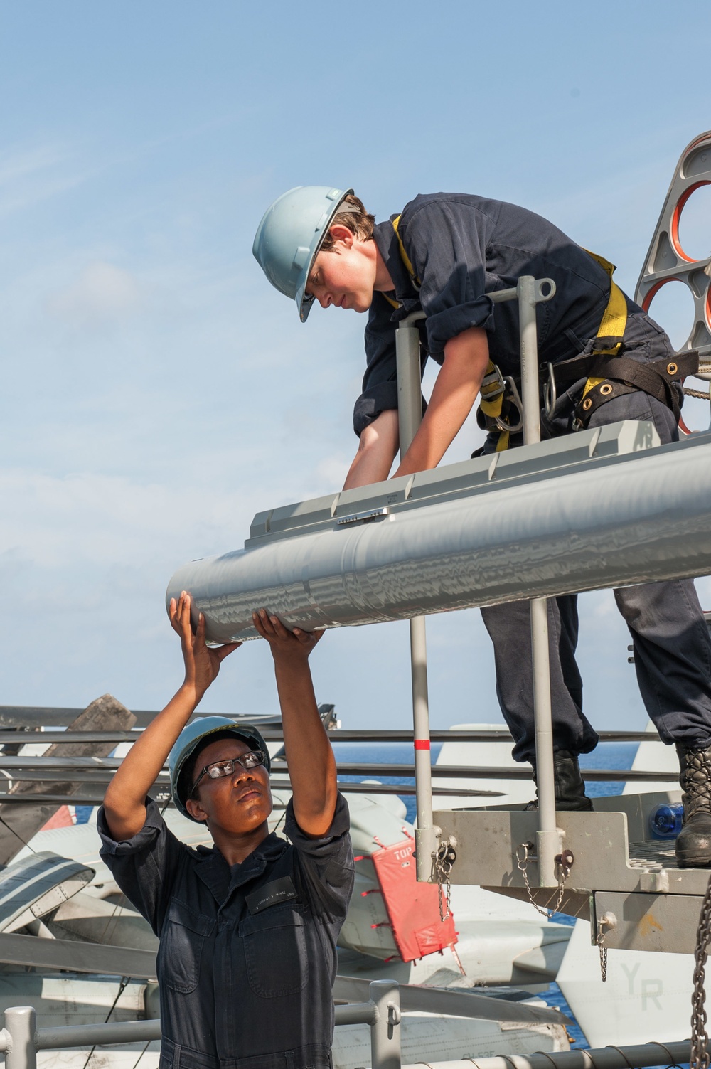 USS America Sailors move surface-to-air intercept missiles