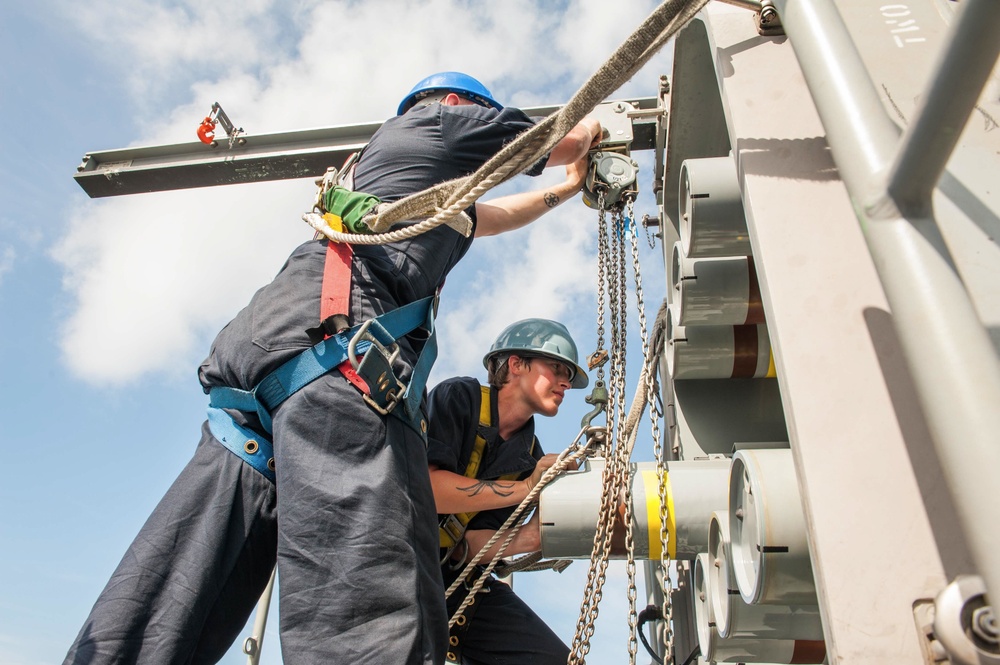 USS America Sailors move surface-to-air intercept missiles