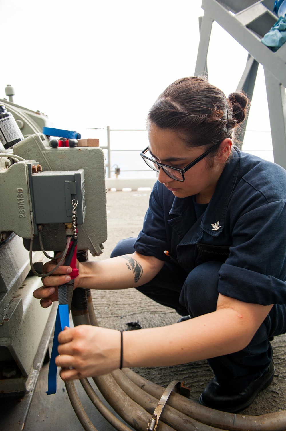 USS America Sailor conducts maintenance