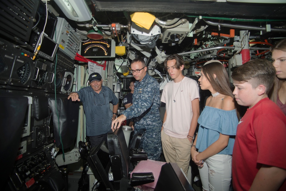 Retired Submariner and Grandchildren Tour Guam Submarine Control Room