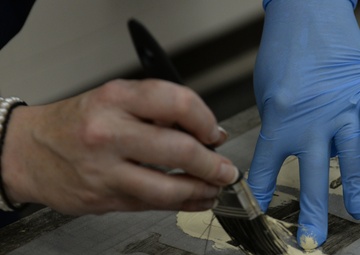 Hammering out tedium, touching up memories