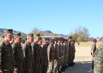 U.S. Marines and members of South African Maritime Reaction Squadron stand in formation during Exercise Shared Accord