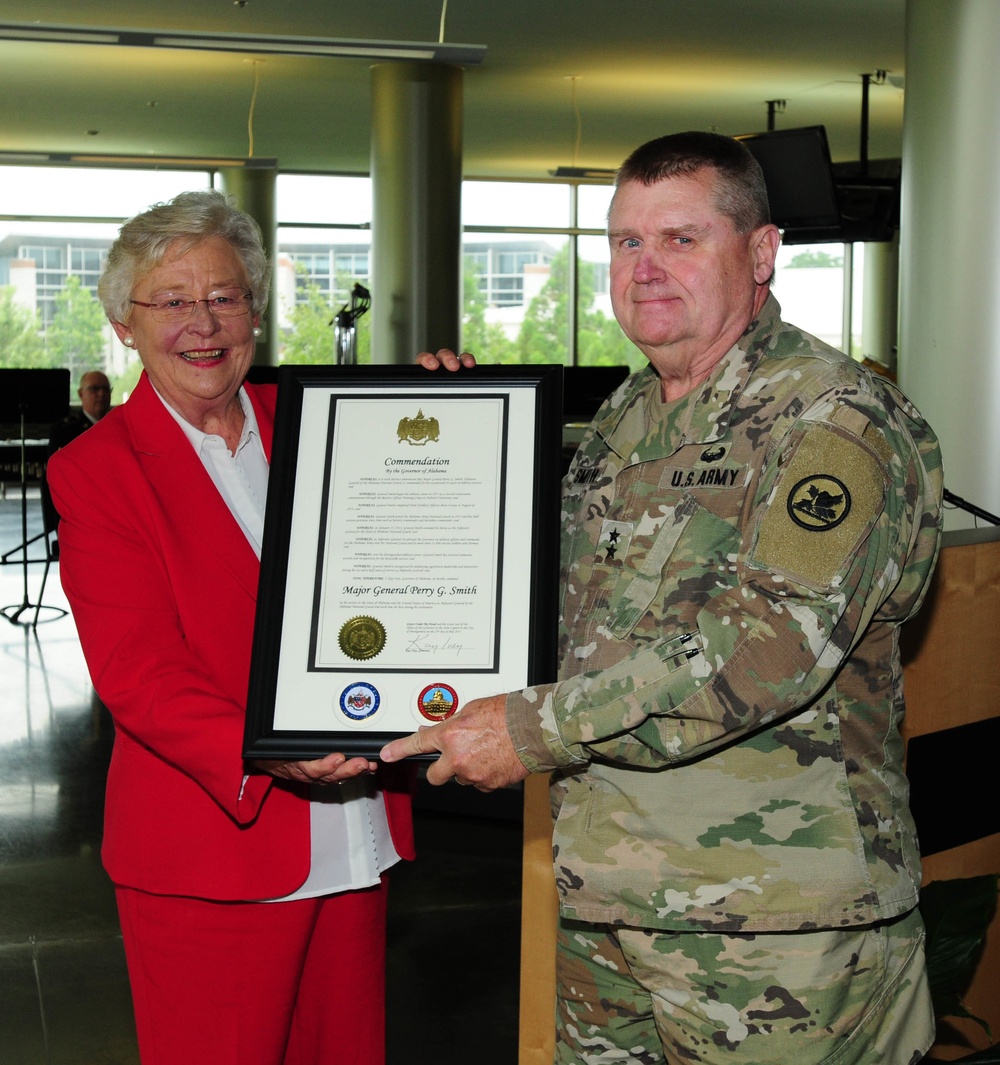 Alabama Gov. Kay Ivey presents Maj. Gen. Perry G. Smith a commendation award during a change of command ceremony at Alabama National Guard Joint Force Headquarters, Montgomery, Alabama, July 28, 2017.