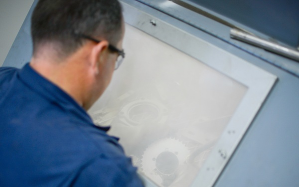 Sandblasting MAAS components.