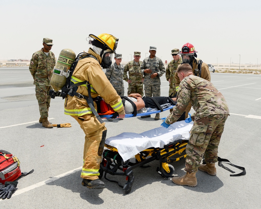 Leadership of the 379th Air Expeditionary Wing get a first-hand look at the base clinic and a 911 emergency response exercise