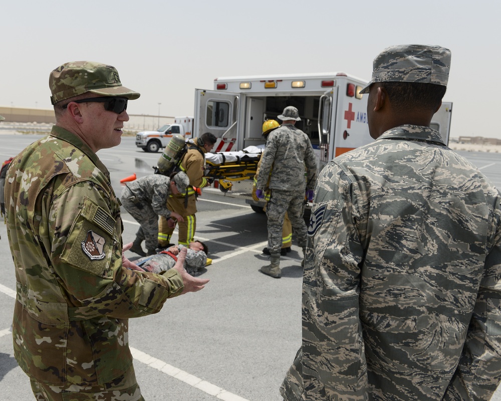 Leadership of the 379th Air Expeditionary Wing get a first-hand look at the base clinic and a 911 emergency response exercise