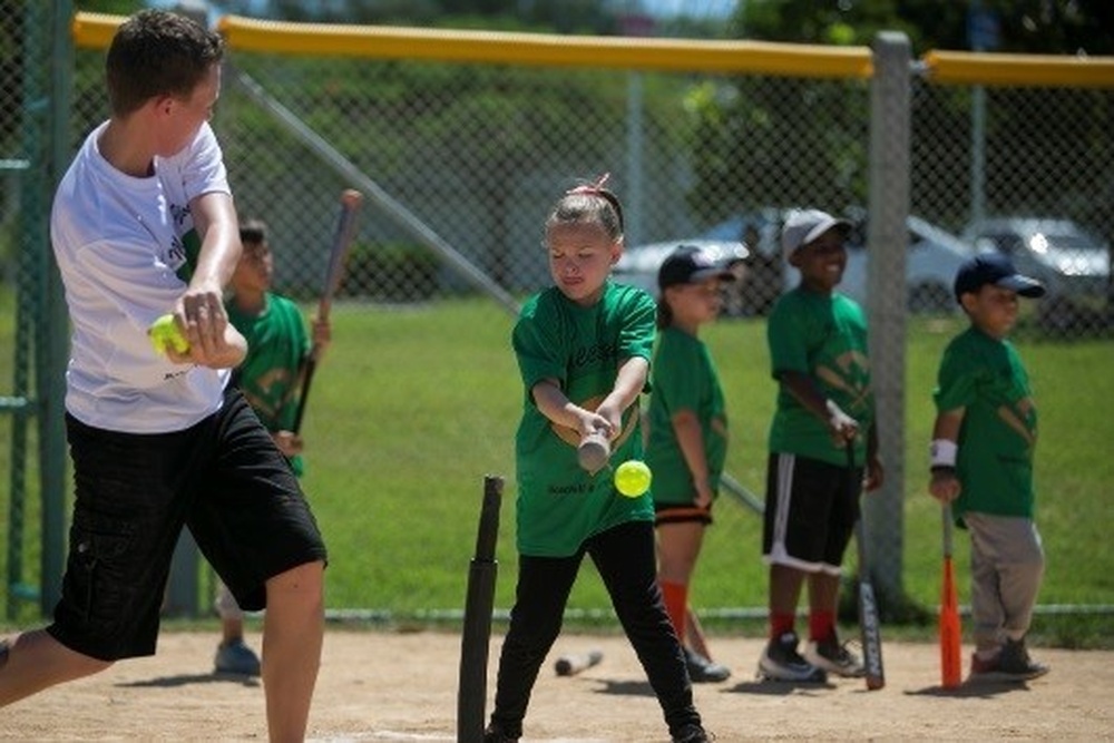 CAMP FOSTER, Okinawa, Japan – A child practices batting at a youth baseball  clinic July 29 aboard Camp Foster, Okinawa, Japan. The baseball clinic  hosted four different stations: hitting, running, catching and