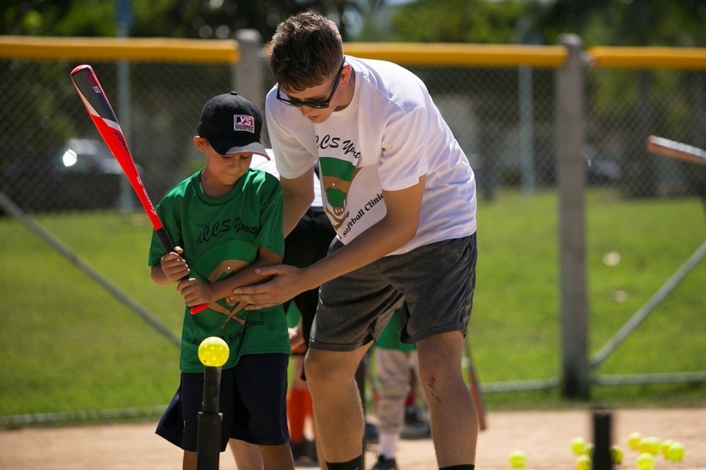 CAMP FOSTER, Okinawa, Japan – A child practices batting at a youth baseball  clinic July 29 aboard Camp Foster, Okinawa, Japan. The baseball clinic  hosted four different stations: hitting, running, catching and