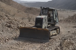Equipment operators complete road construction to help facilitate US/French mission operations