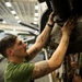 Marine conducts maintenance on helo