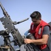 Sailor Cleans .50 Caliber Machine Gun