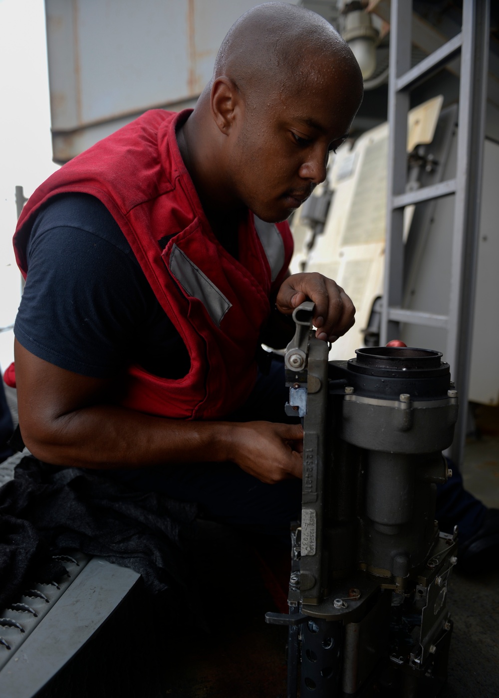 Sailor Performs Maintenance