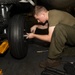 Marine changes a tire