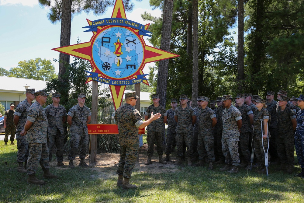Engineers with CLB-8 present the Regimental CO with a new sign