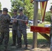 Engineers with CLB-8 present the Regimental CO with a new sign