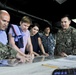 Staff delegates from the Senate and House Appropriations Committees tour USS Emory S. Land (AS 39)